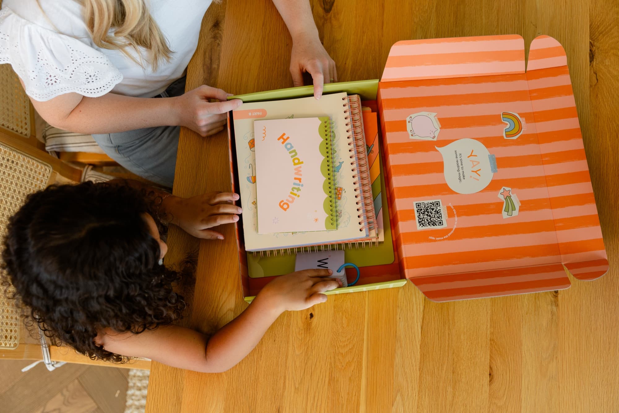 A mom and daughter opening their Bright & Brilliant box together